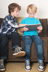 Image showing Kid working on a tablet computer