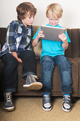 Image showing Kid working on a tablet computer