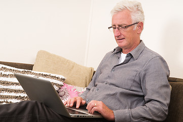 Image showing Senior working on a laptop