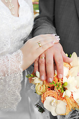 Image showing Wedding: hands, rings and bouquet