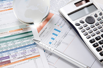 Image showing financial charts and graphs on the table 