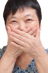 Image showing old woman covering her mouth