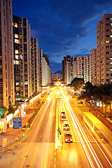 Image showing modern urban city at night with freeway traffic