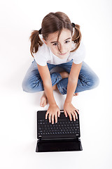 Image showing Little student girl with a laptop