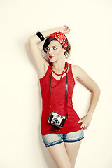 Image showing Pin-up girl with a camera