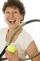 Image showing excited middle age senior woman athlete tennis player