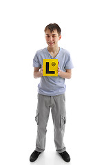 Image showing Teen boy holding L learner plates