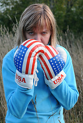 Image showing Angry Woman Wearing Boxing Gloves