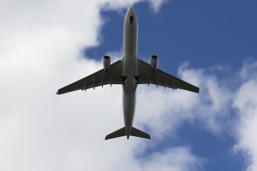 Image showing A commercial airplane flying over