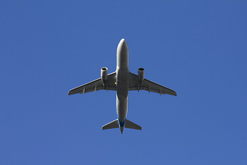 Image showing A commercial airplane flying over