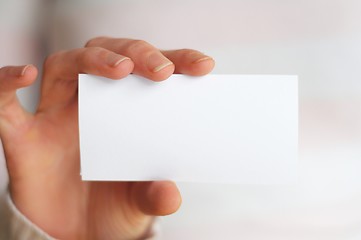Image showing hand and blank paper with copyspace