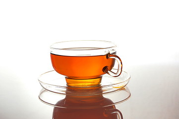 Image showing cup of tea on white with reflection