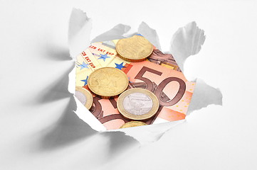 Image showing euro money behind hole in paper