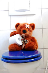 Image showing toy teddy bear on wc toilet