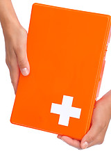 Image showing Hands of young woman holding first aid kit