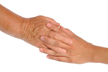 Image showing Hands of young and senior women - helping hand concept - clipping path included