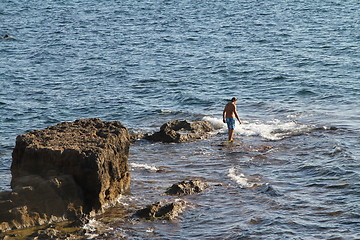 Image showing Man in water swimming