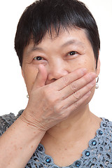 Image showing old woman covering her mouth