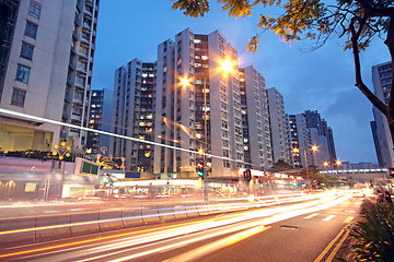 Image showing traffic in downtown at sunset moment