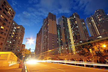 Image showing modern urban city at night with freeway traffic