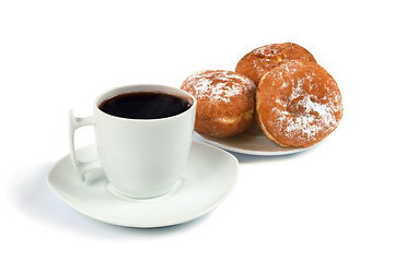 Image showing A cup of coffee and saucer with donuts