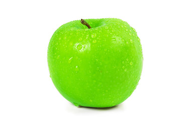 Image showing Wet green apple with water spray