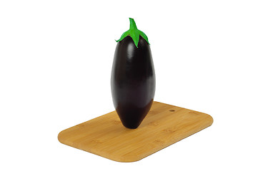 Image showing Eggplant on wooden board isolated on white.