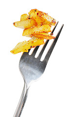 Image showing Fried potatoes  on  a fork