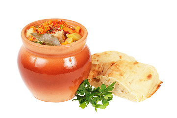 Image showing Roast in a pot and pita bread