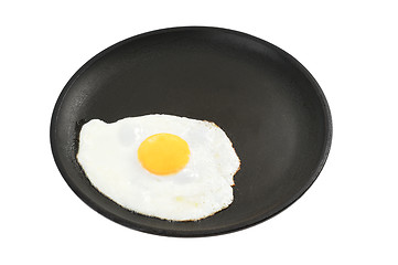 Image showing Fried eggs on a frying pan