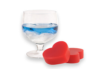 Image showing A two glasses of liqueur with two hearts.