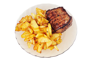Image showing Grilled meat and  fried  potatoes  on a plate