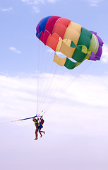 Image showing Parachute in tow with two people
