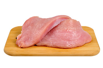 Image showing Turkey meat on a wooden board