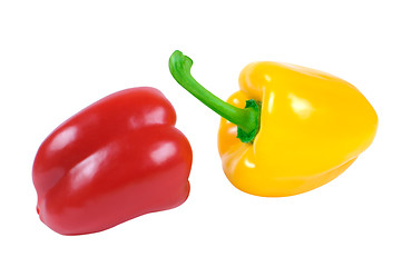 Image showing Two peppers - red and yellow in a piquant position