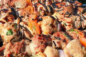 Image showing Kebabs, threaded on a skewer and grill.