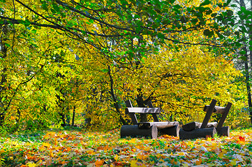 Image showing Autumn landscape. Bench in the park