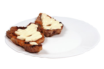 Image showing Grilled meat  with  mayonnaise  on a plate.