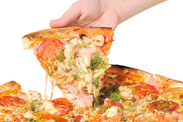 Image showing Pizza and slice of pizza in hand