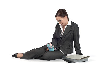 Image showing Young business woman playing with a toy