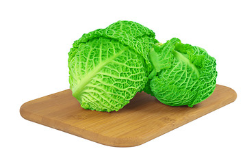 Image showing Savoy cabbage on a wooden board