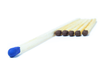 Image showing A number of identical matches and one which differ