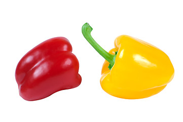 Image showing Two peppers - red and yellow in a piquant position