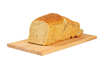 Image showing Sliced bread on wooden board.