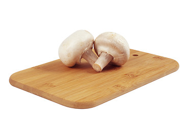 Image showing Mushrooms on a wooden board.