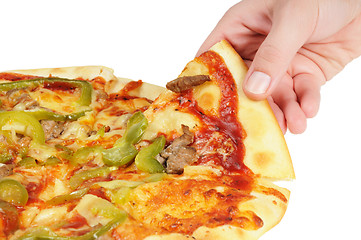 Image showing Pizza and slice of pizza in hand