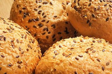 Image showing Bun, topped with sesame seeds in a basket