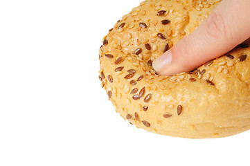 Image showing Bun, topped with sesame seeds pressed with finger