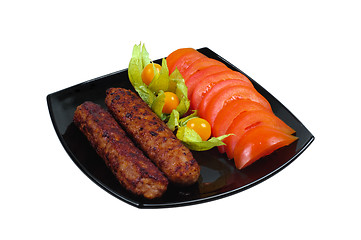 Image showing Kebab with vegetable garnish