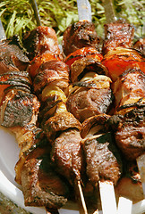 Image showing Grilled meat on a skewer. Close up